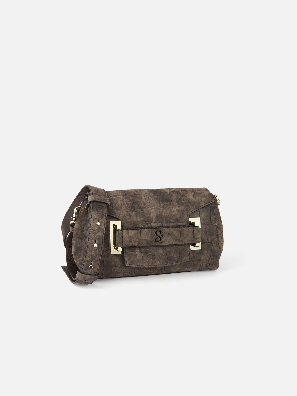A dark charcoal grey suede handbag featuring a subtle crocodile-embossed pattern. The bag includes an adjustable shoulder strap, a front flap with a leather strap detail, an embossed logo, and polished silver accents.
