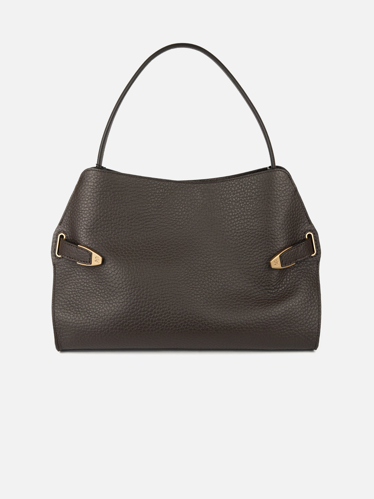 Frontal studio shot of a dark brown pebbled-leather shoulder bag featuring a relaxed, slouchy silhouette with a single slender top strap. Side leather cinching tabs are detailed with engraved gold-tone metal hardware tips, set against a plain light grey background.