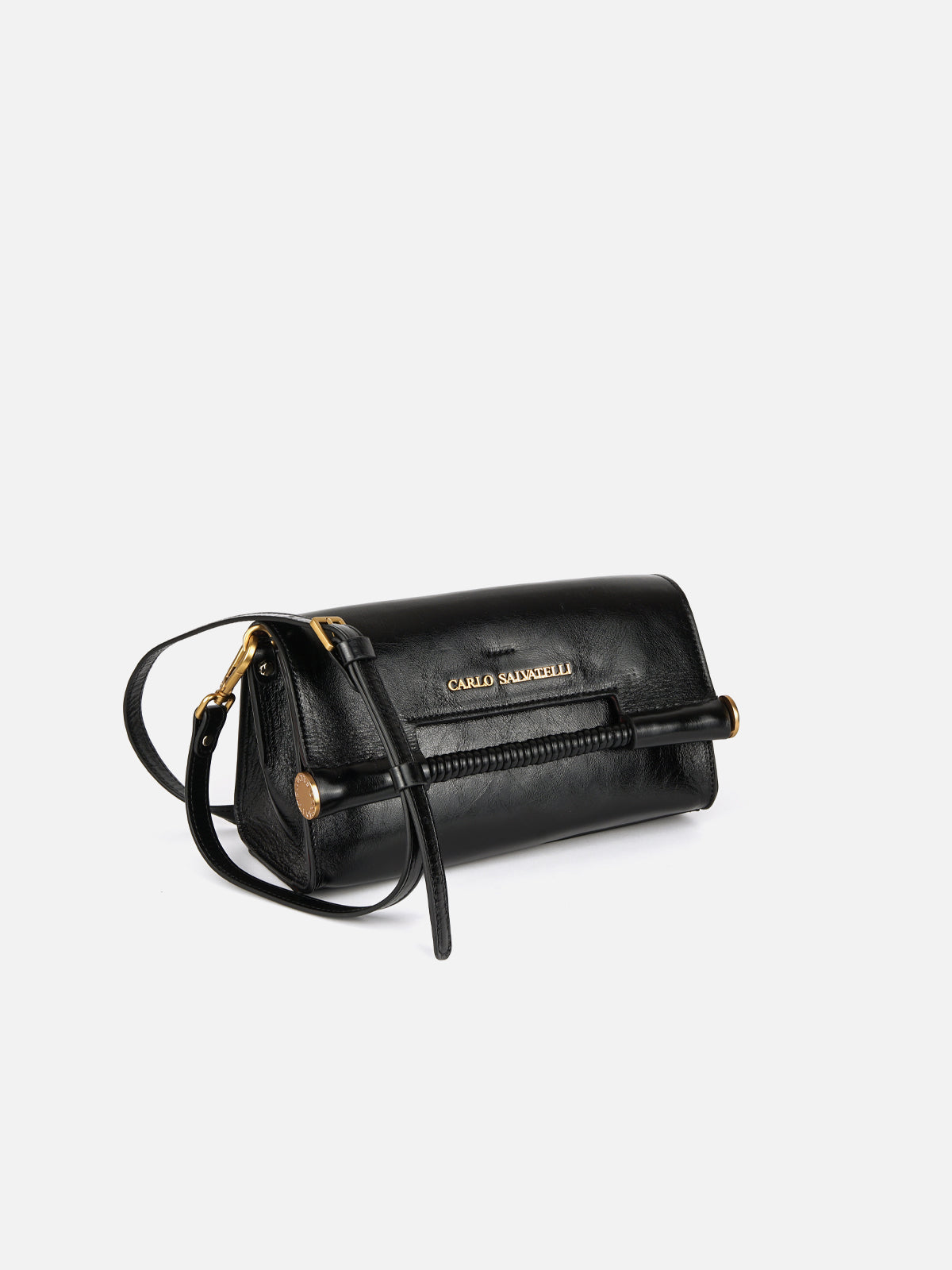 Three-quarter view of a black high-gloss patent leather East-West shoulder bag. The bag features a horizontal front flap with gold-tone 'Carlo Salvatelli' lettering, an adjustable leather strap, and a distinctive ribbed cylindrical bar handle tucked under the flap with gold end caps.