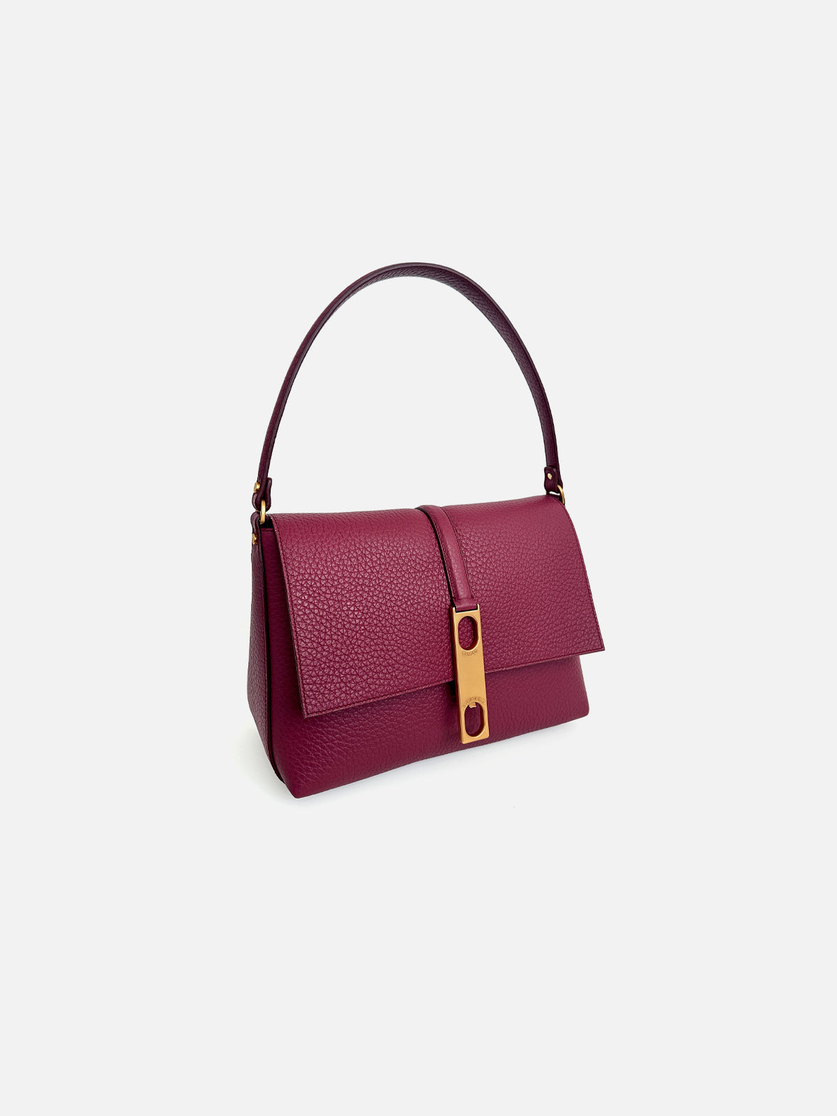 Three-quarter view of a luxury black saffiano leather top-handle tote bag featuring dual tall shoulder handles and a vertical leather tab with a signature gold-tone metallic buckle closure.