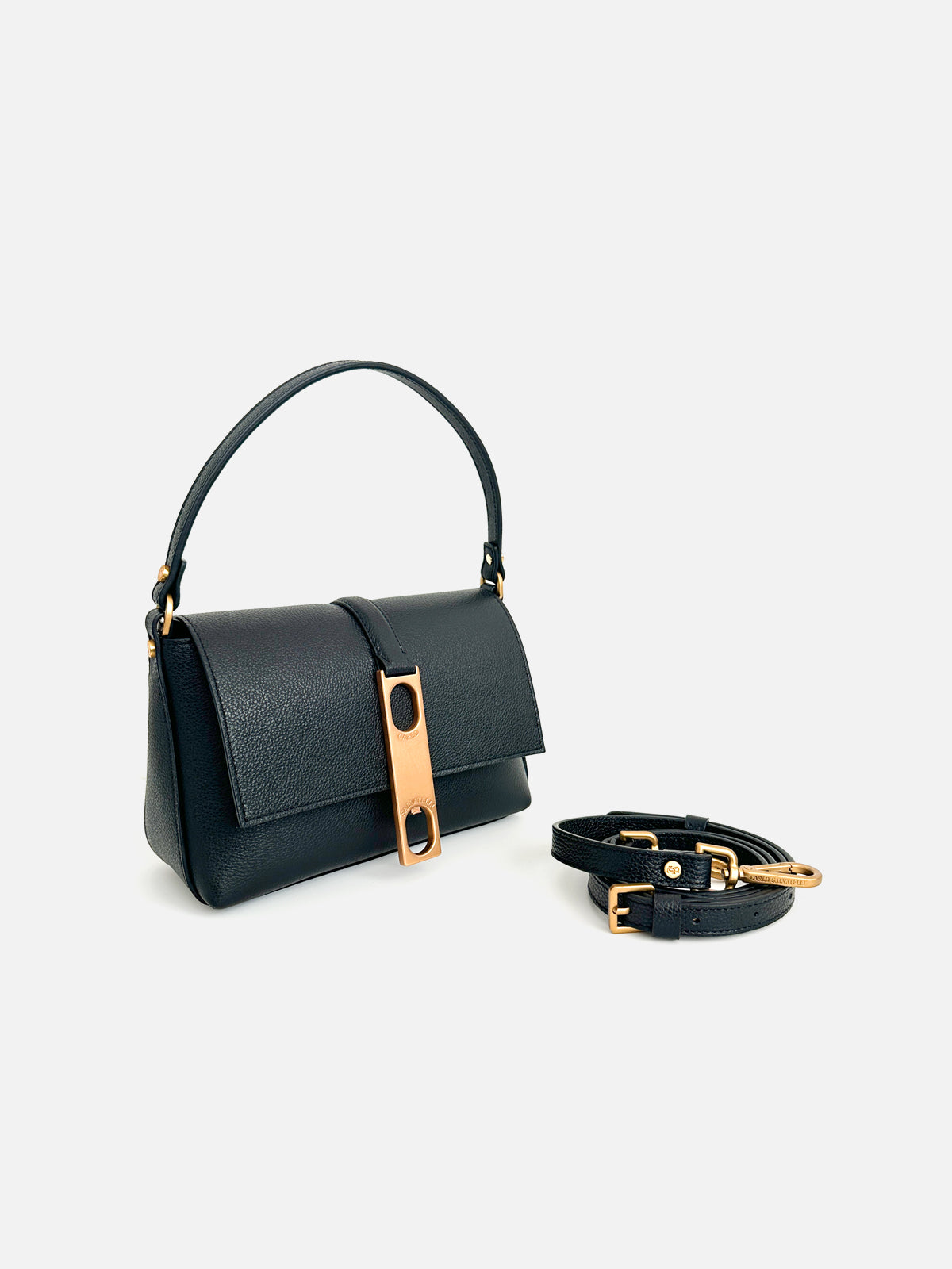 Elegant magent leather shoulder bag with a pebble grain texture, featuring a structured rectangular design and a striking vertical gold-tone metal hardware clasp with dual cutouts. Set against a clean white studio background.